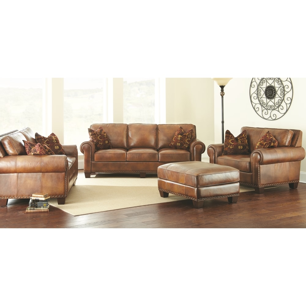 Steve Silver Sanremo Top Grain Leather Sofa with Nail Head Trim and Decorative Pillows
